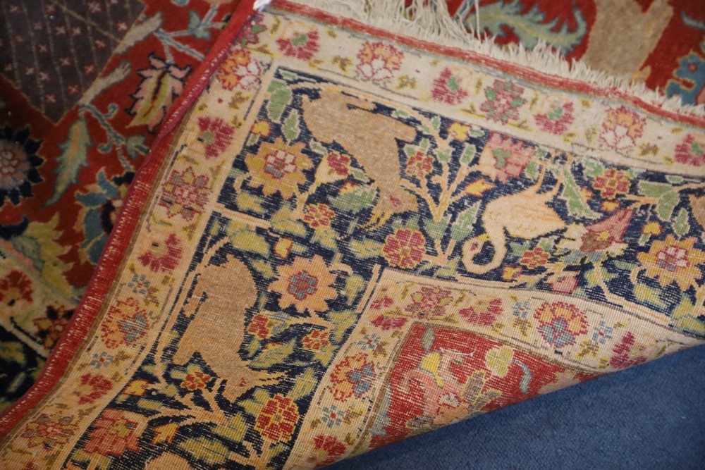 A Caucasian red ground rug, 6ft by 4ft 7in.